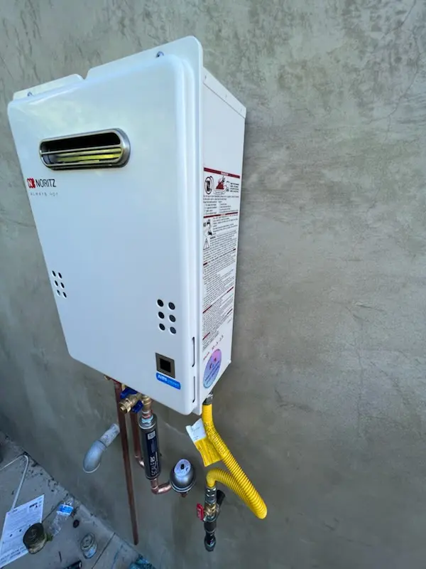 Tankless water heater installation for The Woods of Bartlett homes